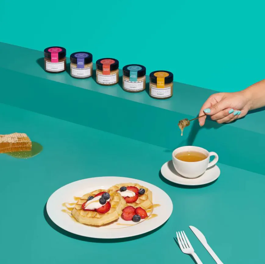 Offer this collection of small jars of honey as housewarming gift ideas