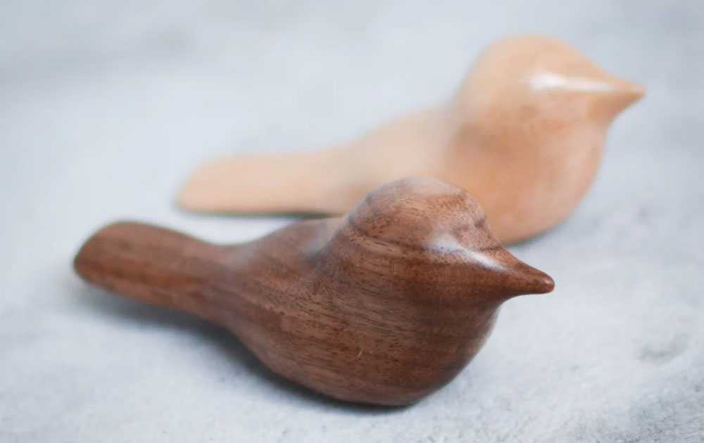 Carved birds for to calm the new mom